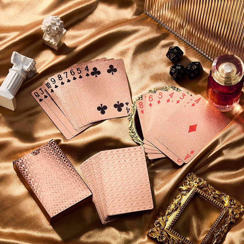Persephone's Pack Metallic Rose Gold Playing Cards - A deck of lovely, classy playing cards with a pink or copper hue, and a geometric print on the back.