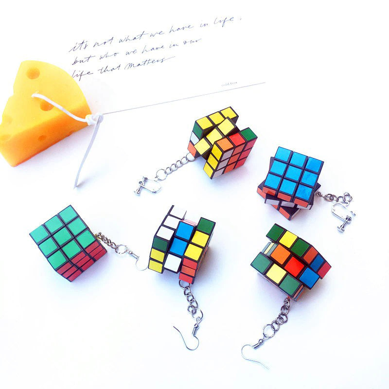 Retro Revival Rubix Cube Earrings - Large plastic earrings featuring real, working rubix cubes suspended from a french hook on a short length of chain. 