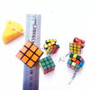 Retro Revival Rubix Cube Earrings - Large plastic earrings featuring real, working rubix cubes suspended from a french hook on a short length of chain.