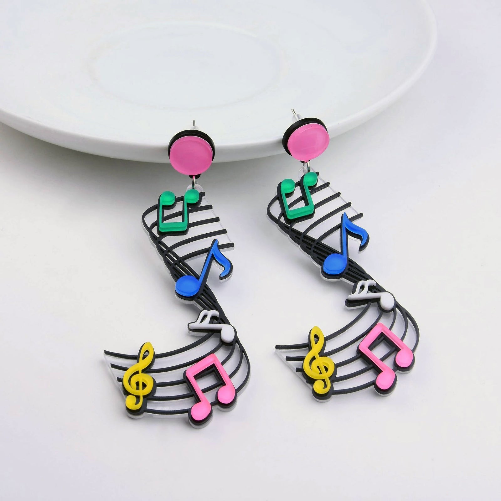 Retro Revival Soundtrack of the Soul Earrings - Large plastic earrings decorated with neon coloured musical notes in an artistic fashion.