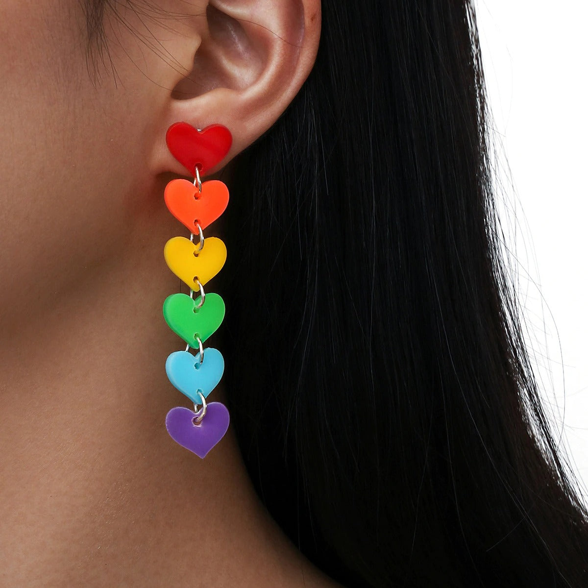 Retro Revival What The Heart Wants Earrings - A string of cute plastic hearts suspended from a straight post earring, in bright neon colours. 