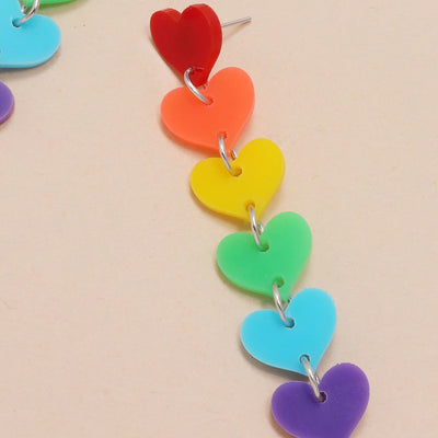 Retro Revival What The Heart Wants Earrings - A string of cute plastic hearts suspended from a straight post earring, in bright neon colours.