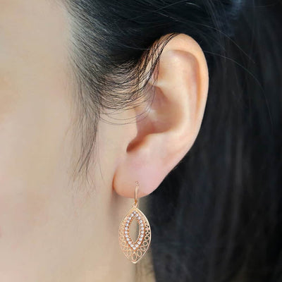 Saraiah Lever Back Dangle Earrings - Small rose gold earrings with tiny quartz stones, shaped like a stylised leaf.
