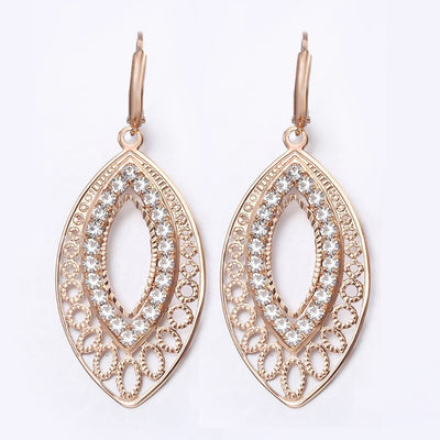Saraiah Lever Back Dangle Earrings - Small rose gold earrings with tiny quartz stones, shaped like a stylised leaf.