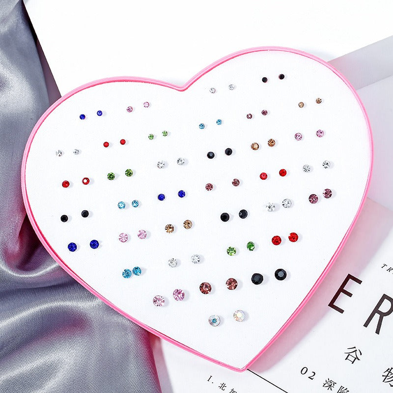The Sassy Fash Children's Earring Set - an assortment of silicone-stemmed hypoallergenic earrings in a cute heart-shaped box.