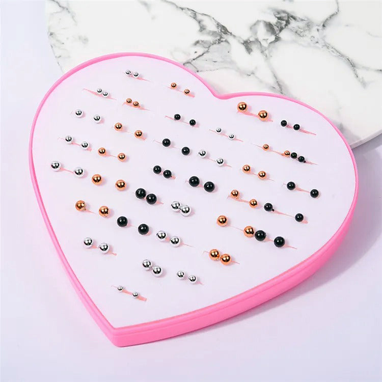 The Sassy Fash Children's Earring Set - an assortment of silicone-stemmed hypoallergenic earrings in a cute heart-shaped box.