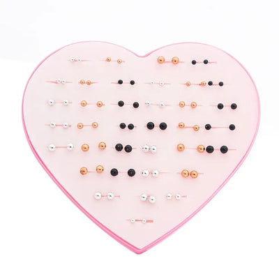 The Sassy Fash Children's Earring Set - an assortment of silicone-stemmed hypoallergenic earrings in a cute heart-shaped box.