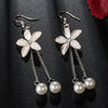 Spring Beauty Dangle Earrings - Lovely delicate floral earrings with a small crystal flower sitting just below the lobe and a pair of long chains adorned with small pearls.