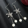 Spring Beauty Dangle Earrings - Lovely delicate floral earrings with a small crystal flower sitting just below the lobe and a pair of long chains adorned with small pearls.