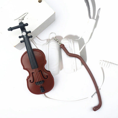 Teenytopia Hello Cello Earrings - A pair of huge plastic earrings featuring a cello and oversized bow.