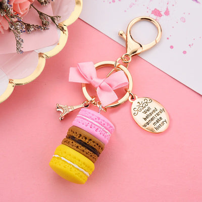 Teenytopia Oh Là Là Macaron Key Chain - An adorable, ultra-femme key chain featuring a stack of colourful macarons, a trinket of the eiffel tower, and a small oval with a phrase on it.