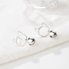 Tinklebell Silver Cat Bell & Tassel Earrings - A pair of simple silver earrings with a cat-shaped charm at the lobe, and a short length of silver chain with a bell on the end.