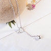 Tinklebell Silver Cat Bell Necklace - A very delicate silver chain necklace with a cat-head charm and a small bell attached to it.