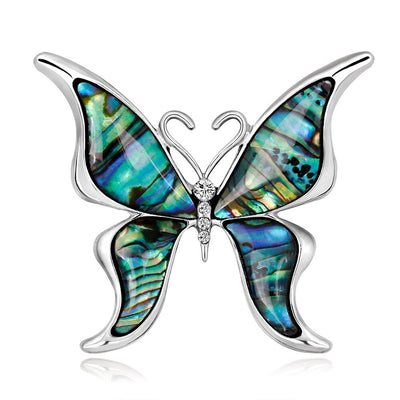 The Tropicana Lani Brooch - A beautiful silver-toned zinc alloy butterfly brooch adorned with crystals and polished paua shell.