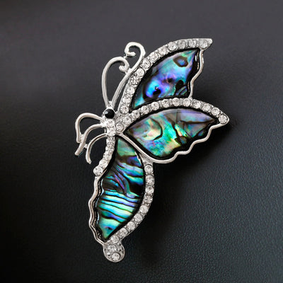 The Tropicana Leilani Brooch - A beautiful silver-toned zinc alloy butterfly brooch adorned with crystals and polished paua shell.