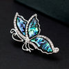 The Tropicana Leilani Brooch - A beautiful silver-toned zinc alloy butterfly brooch adorned with crystals and polished paua shell.
