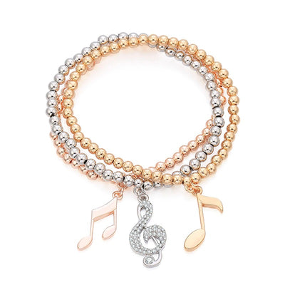 Whitney Stretch Bracelet Set - A set of simple beaded stretch bangles in beautiful gold, rose gold, or silver, with little charms that look like musical notes.