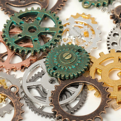 Cheeky Crafter Steampunk Gears - A pile of little metal gears designed for crafting, in a mix of gold, silver, bronze, copper, and other metallic colours.