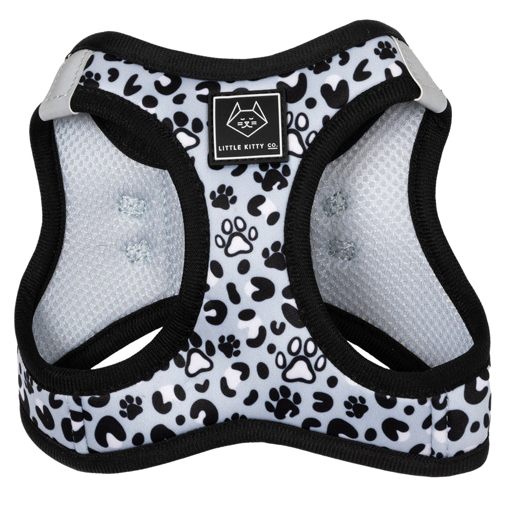 Little Kitty Co. Cat Step-In Harness - Wild Paws features a simple and elegant monochrome palette dotted with cute cartoon kitty paws, in a fun new take on the traditional white leopard print.