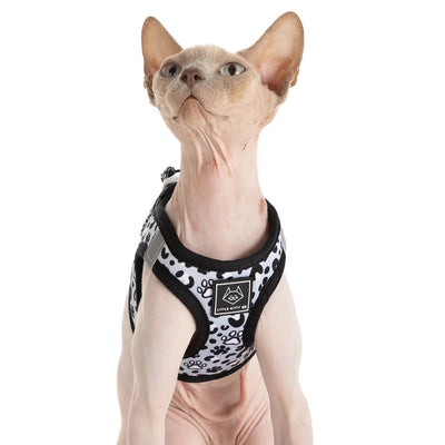 Little Kitty Co. Cat Step-In Harness - Wild Paws features a simple and elegant monochrome palette dotted with cute cartoon kitty paws, in a fun new take on the traditional white leopard print.