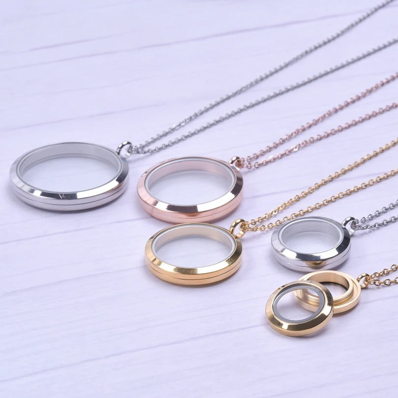 Mnemosyne Twist Floating Locket - A stainless steel locket with panels of glass front and back so that they contents of the locket can be seen from both sides.