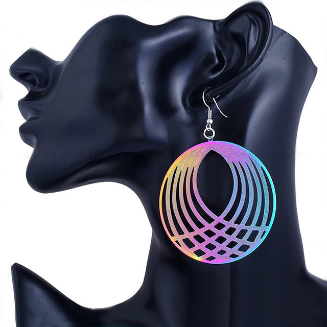 The Dazzle Collection - Hypnotika - Huge round UV treated stainless steel earrings that glow in a rainbow of colours. 