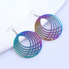 The Dazzle Collection - Hypnotika - Huge round UV treated stainless steel earrings that glow in a rainbow of colours.