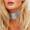 The Diva Drape Choker - A simple close-fitting necklace made of metal sequin mesh, available in gold, silver, or obsidian (black), and available in ether 25mm tall or 40mm tall.
