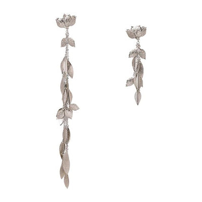 The Naomi Asymmetrical Vine Earrings - Long leaf-themed earrings available in gold or silver toned zinc alloy, with adjustable leaf charms.