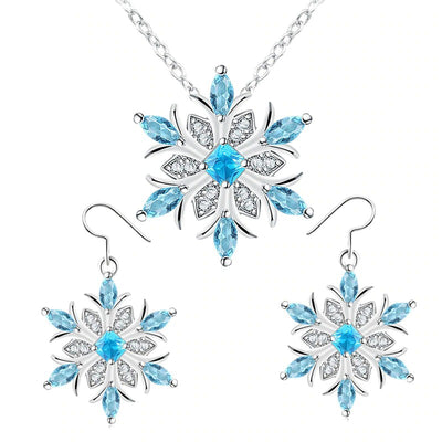 A beautiful snowflake pendant and earrings with blue topaz stones.