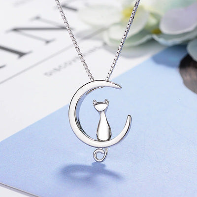 Moonlight Meowl Set - A delicate sterling silver jewellery set featuring a tiny kitty sitting on a crescent moon.