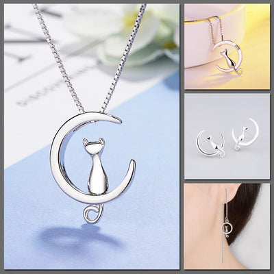 Moonlight Meowl Set - A delicate sterling silver jewellery set featuring a tiny kitty sitting on a crescent moon.
