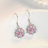 Asuka Cherry Blossom French Hook Earrings - Small, delicate crystal earrings shaped like little flowers.
