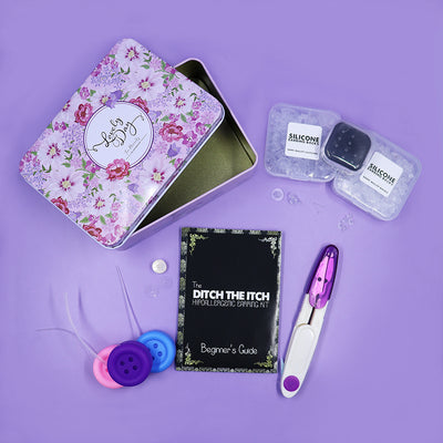 The Ditch The Itch Hypoallergenic Earring Kit - A small metal tin containing an assortment of different items designed to be applied to earrings to make them less likely to trigger allergic reactions.