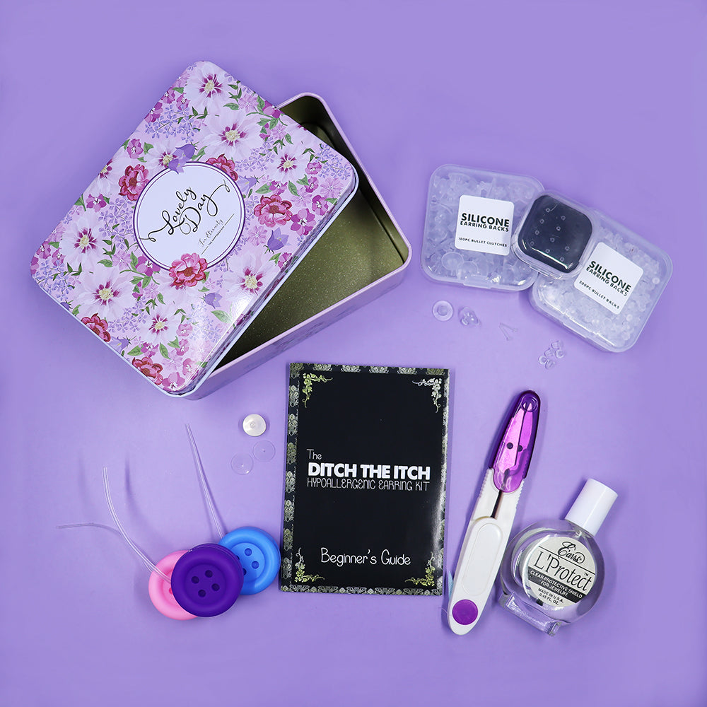 The Ditch The Itch Hypoallergenic Earring Kit - A small metal tin containing an assortment of different items designed to be applied to earrings to make them less likely to trigger allergic reactions.