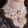 The Annabelle Choker - A white lace choker adorned with faux pearls and bronze hardware.
