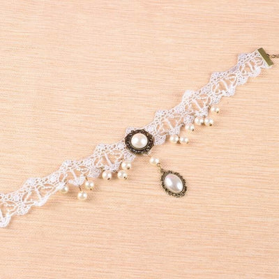 The Annabelle Choker - A white lace choker adorned with faux pearls and bronze hardware.