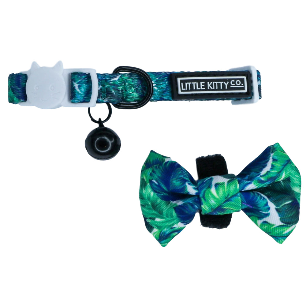 Little Kitty Co. Cat Collar & Bow Tie - Vacay Palms (Limited Edition) - A vibrant green cat collar with a leaf motif. It has a white cat-shaped buckle, a black bell, and a matching bowtie that can be attached with velcro. 