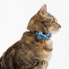 Little Kitty Co. Cat Collar & Bow Tie - Scaled Back (Limited Edition) - A lovely purple blue cat collar with a scale motif. It has a white cat-shaped buckle, a black bell, and a matching bowtie that can be attached with velcro.