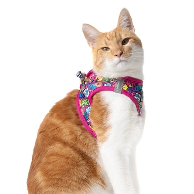 Little Kitty Co. Cat Step-In Harness - Graffiti (Limited Edition) - A brightly coloured cat harness with a hot pink mesh lining, and a colourful outer layer. The print includes an assortment of cute cartoon cats, food, and pop-art style words.