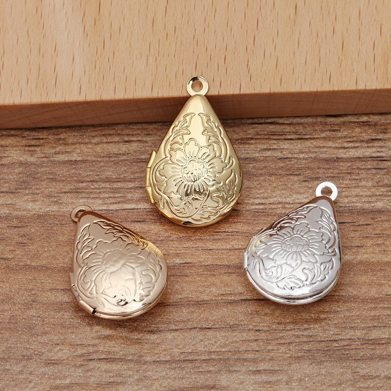 Lovely Lockets - Small Teardrop - A tiny droplet shaped locket embossed with flowers, available in gold and silver.
