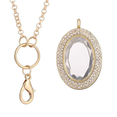 Ourania Magnetic Floating Locket - An oval shaped locket encrusted with small crystals.  This is a photo locket, so it has glass panels front and back that ensure anything in the locket can be seen from both sides. Available in gold, gunmetal (dark silver), rose gold, or silver coloured. Comes with a matching chain.