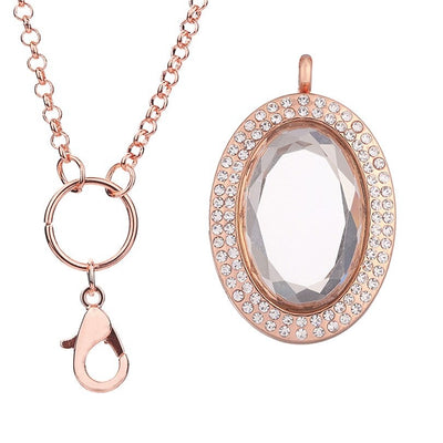 Ourania Magnetic Floating Locket - An oval shaped locket encrusted with small crystals.  This is a photo locket, so it has glass panels front and back that ensure anything in the locket can be seen from both sides. Available in gold, gunmetal (dark silver), rose gold, or silver coloured. Comes with a matching chain.