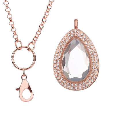Melpomene Magnetic Floating Locket - A tear or water drop shaped floating locket with crystal-like glass and gemstones around the outside.