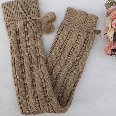 The Snuggle Weather Leg Warmers - A pair of adorable knit over-knee leg warmers available in six snuggly winter colours: Blackout (black), Hot Chocolate (dark brown), Tempest (dark grey), Overcast (light grey), Gingerbread (light brown), and Snowdrift (white).