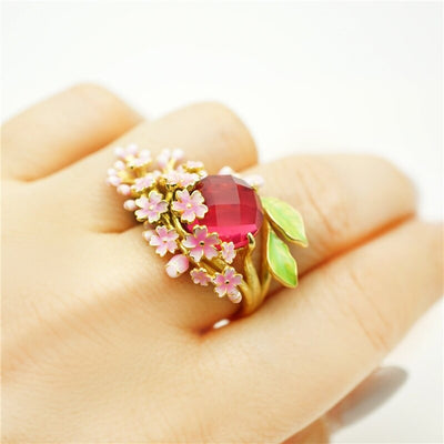 The Anthousai Ring - A lovely vibrant floral ring with a large coloured crystal surrounded by tiny enamel flowers and leaves.