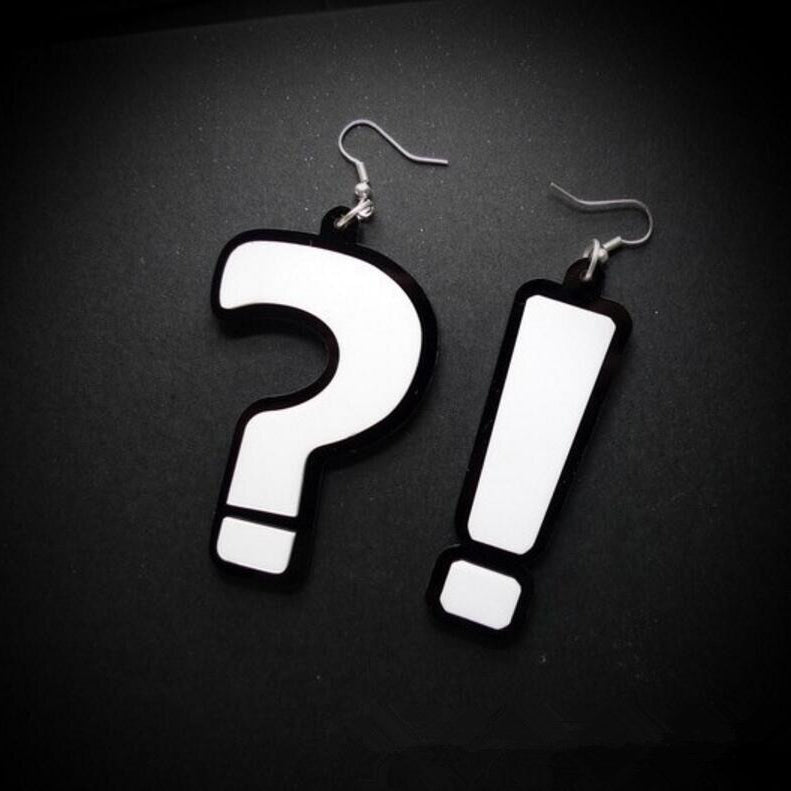 Retro Revival Interrobang Earrings - Large acrylic comic book style earrings featuring a question mark (?) and exclamation point (!) which form a symbol called in interrobang (!?) when worn together. 